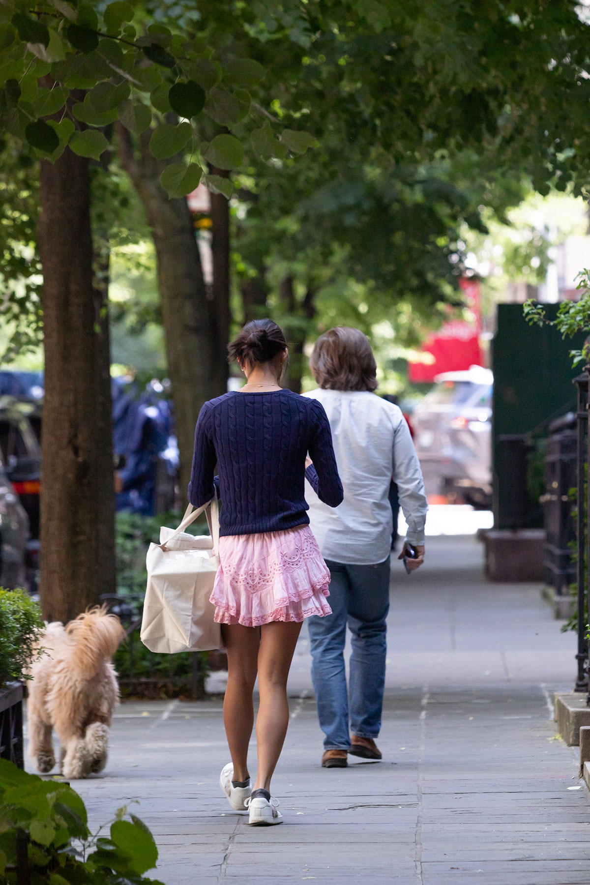 People walking down the sidewalk